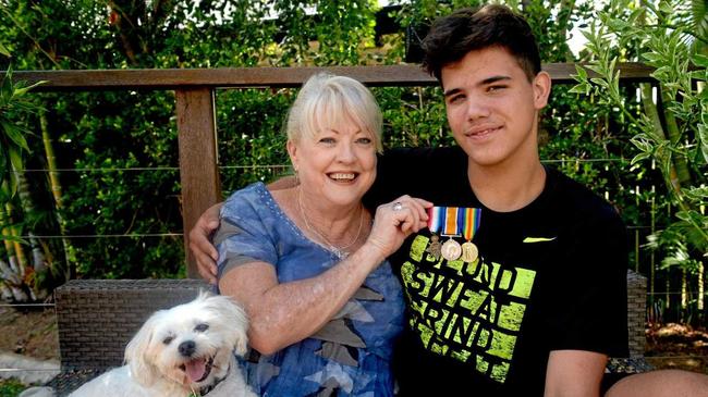 NOT FORGOTTEN: Georgie the dog and grandson Macka are happy to have Carleen Hawk's grandfather's medals home. Picture: Jann Houley