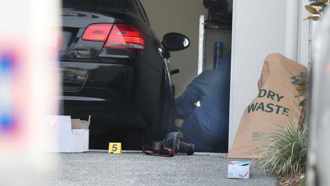 Forensic officers at the scene where Bowden was gunned down. Picture: Courier Mail