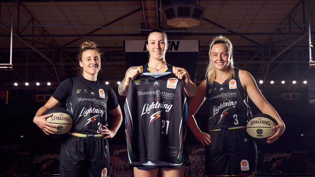 Lauren Mansfield, Marena Whittle, and Brooke Basham (right) unveiling the Adelaide Lightning’s new pride jersey in January. Picture: Matt Loxton