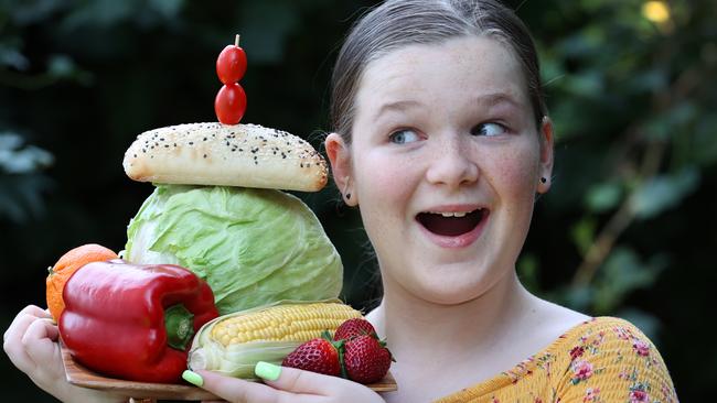 Ella, 11, enjoys fresh fruit and vegetables, which help teen brains develop. Picture: David Caird