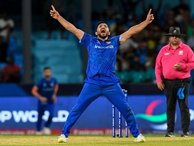 Afghanistan's Gulbadin Naib celebrates after the dismissal of  Australia's Glenn Maxwell during the ICC men's Twenty20 World Cup 2024 Super Eight cricket match between Afghanistan and Australia at Arnos Vale Stadium in Arnos Vale, Saint Vincent and the Grenadines on June 22, 2024. (Photo by Randy Brooks / AFP)