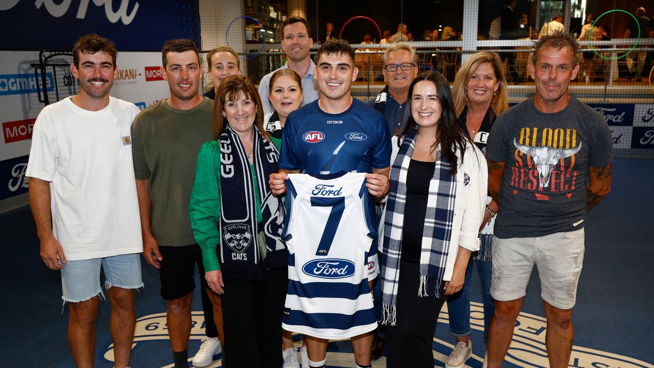 GEELONG, AUSTRALIA - MARCH 16: Shaun Mannagh of the Cats poses with friends and family after being presented with his jumper during the 2024 AFL Round 01 match between the Geelong Cats and the St Kilda Saints at GMHBA Stadium on March 16, 2024 in Geelong, Australia. (Photo by Michael Willson/AFL Photos via Getty Images)