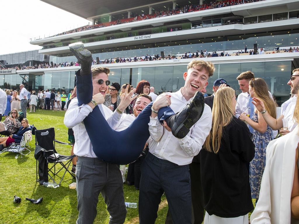 Some racegoers were too tired to stand by the end. Picture: Jenny Evans/Getty Images