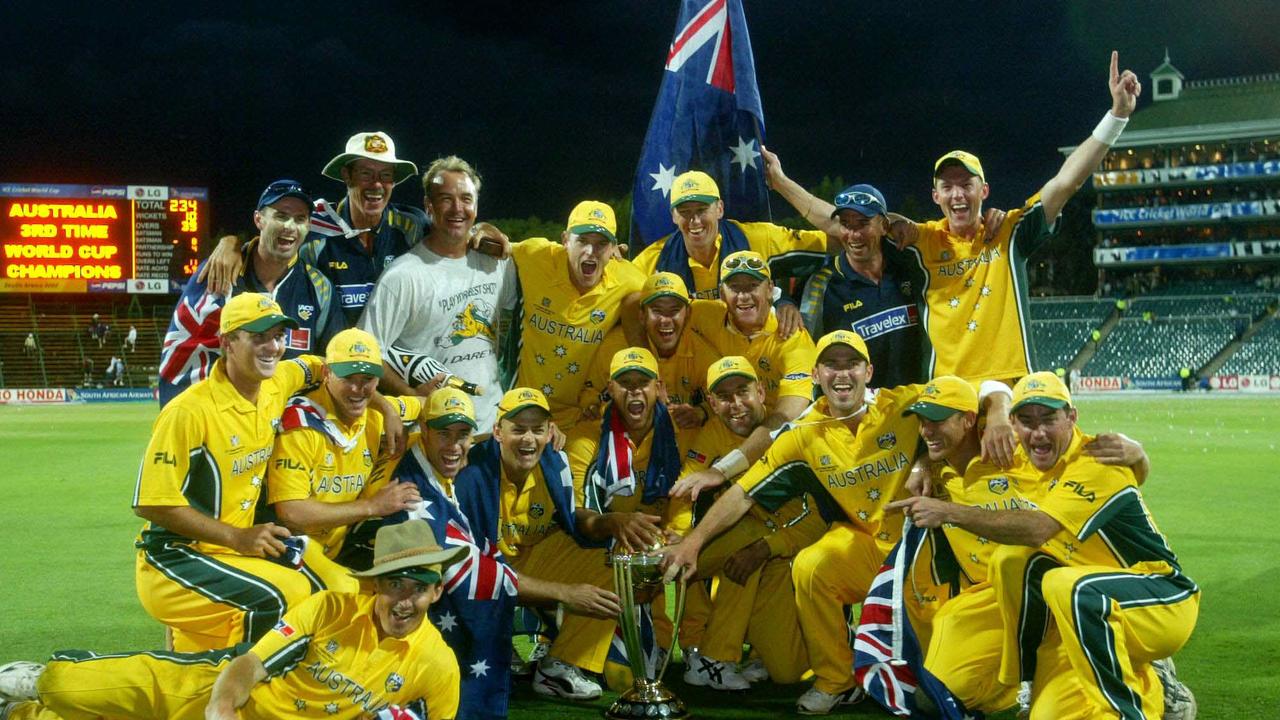 MARCH 23, 2003 : Winning Australian team, (back row L-R) Jock Campbell (fitness coach), John Buchanan (coach), Mick Young (fielding coach), Nathan Bracken, Ricky Ponting (captain), Glenn McGrath, Andy Bichell, Tim Nielsen (assistant coach) &amp; Brett Lee, (middle row L-R) Nathan Hauritz, Ian Harvey, Michael bevan, Adam Gilchrist, Andrew Symonds, Darren Lehmann, Damienn Martyn, Ashley Noffke &amp; Jim Maher &amp; (front row) Brad Hogg, celebrate after defeating India in the 2003 Cricket World Cup final at The Wanderers in Johannesburg, 23/03/03. Pic Phil Hillyard. Trophy