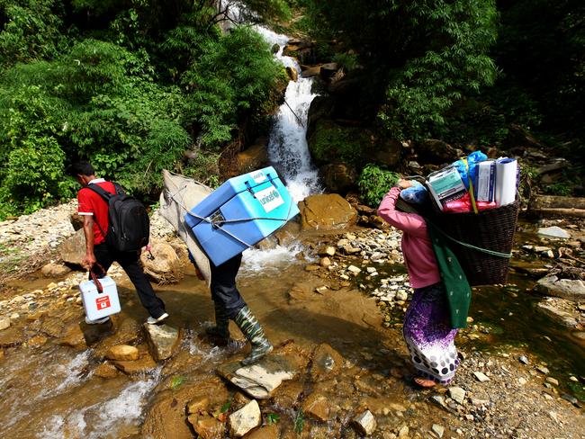 UNICEF is on a mission to deliver two billion Covid vaccinations this year. Workers pictured in Nepal. Picture: UNICEF.