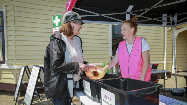 Carol Mountford cleans up at Jen Cunningham’s Washed Up Not Wasted stall at Mt Martha Farmers Market. Picture: Wayne Taylor