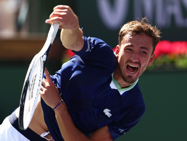 INDIAN WELLS, CALIFORNIA - MARCH 14: Daniil Medvedev of Russia serves against Gael Monfils of France in their third round match on Day 8 of the BNP Paribas Open at the Indian Wells Tennis Garden on March 14, 2022 in Indian Wells, California.   Clive Brunskill/Getty Images/AFP == FOR NEWSPAPERS, INTERNET, TELCOS & TELEVISION USE ONLY ==