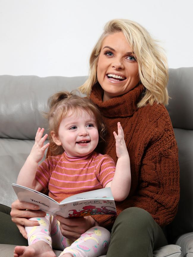 Erin Molan, with daughter Eliza, was inspired to create a range of baby singlets after becoming a mum. Picture: Jonathan Ng