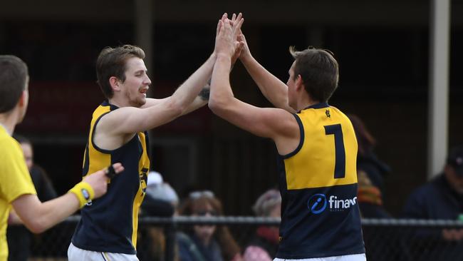 Adrian Cirianni (2nd right) of Hurstbridge reacts after kicking a goal during the NFL match at J.E Moore Park, Reservoir, Melbourne, Saturday, July 21, 2018. West Preston-Lakeside v Hurstbridge