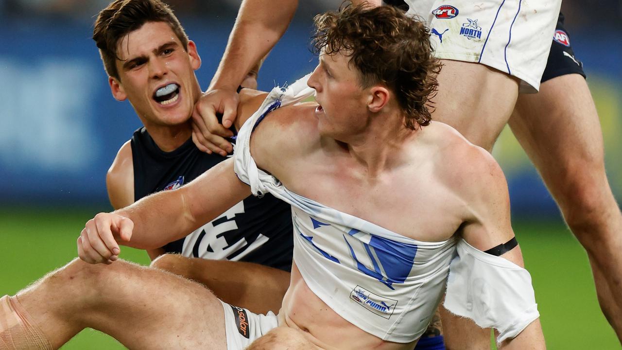 Nick Larkey of the Kangaroos and Lewis Young of the Blues. Photo by Michael Willson/AFL Photos via Getty Images.