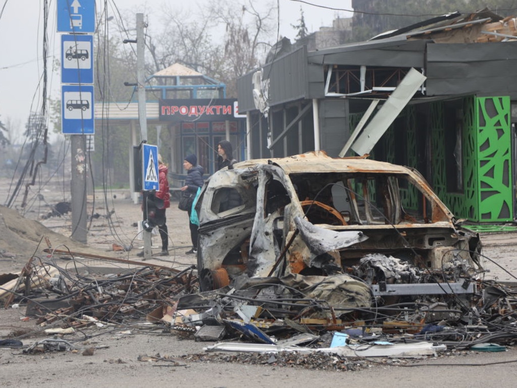 Debris lines the streets of the port city after weeks of sustained strikes.