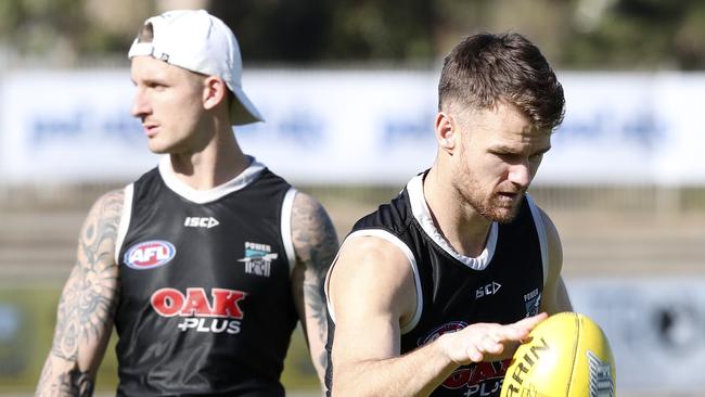 Hamish Hartlett with Robbie Gray at Alberton this week. Hartlett will play at Glenelg on Sunday. Picture Sarah Reed