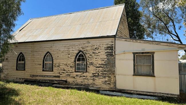 Peeling paint on the outside of the old church.