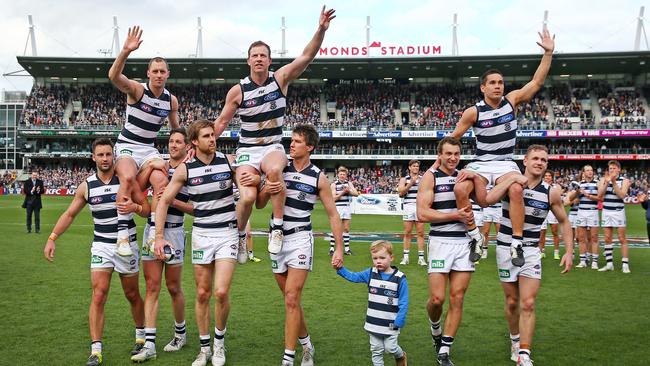 James Kelly, Steve Johnson and Mathew Stokes are chaired off after Round 23, 2015. Picture: Colleen Petch.