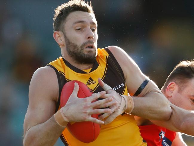 LAUNCESTON, AUSTRALIA - AUGUST 06: Jack Gunston of the Hawks marks the ball over Caleb Graham of the Suns during the 2022 AFL Round 21 match between the Hawthorn Hawks and the Gold Coast Suns at UTAS Stadium on August 6, 2022 in Launceston, Australia. (Photo by Dylan Burns/AFL Photos via Getty Images)