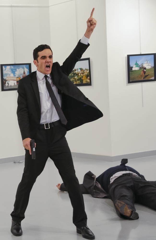 Turkish off-duty police officer Mevlut Mert Altintas (left) shot dead Andrey Karlov (right) the Russian ambassador to Turkey, at an art gallery in Ankara. Picture: AP Photo/Burhan Ozbilici