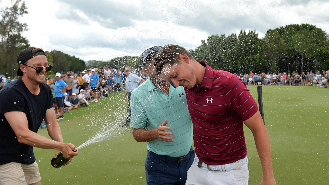 Cameron Smith (R) with father Des (M) after winning the 2017 Australian PGA Championship. Picture: Getty