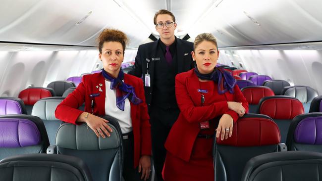 Virgin Australia staff (L-R) Marcella Pirritano, Jason Arends and Jessica Turnbull at Melbourne airport on the day the company announced it has gone into administration due to COVID-19. Picture: Aaron Francis