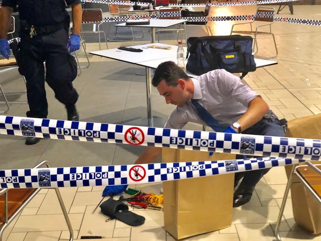 Police gather evidence inside the terminal. Picture: AAP/Sarah Marshall