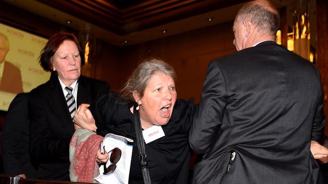 Gaye Demanuele from the Whistleblowers Activists and Citizens Alliance interrupts Prime Minister Malcolm Turnbull’s speech. Picture: AAP