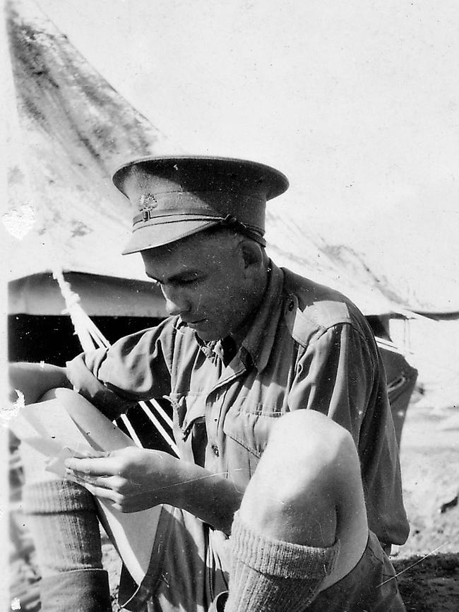“Private Albert William Webb who served with AIF 7th Division Signals as a dispatch rider in WWII. He is reading letters from home in Palestine, 1941.” Picture: Supplied by Helen Moffitt, his daughter