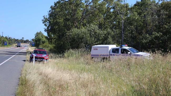 Police appear to be looking through bush land on the eastern side of the Bruce Highway. . Picture: Jordan Gilliland