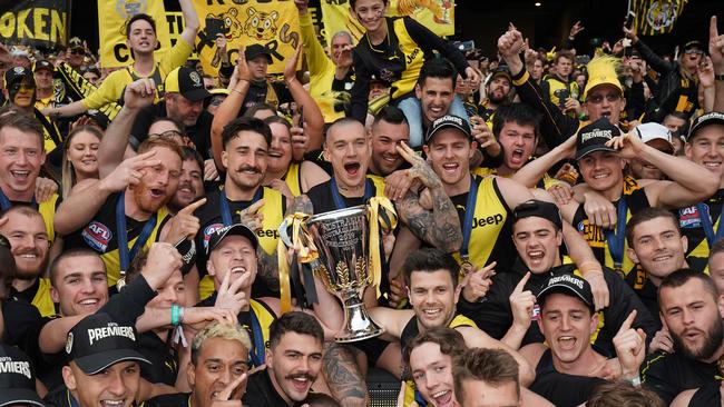 Tigers players celebrate the win during the 2019 AFL Grand Final between the Richmond Tigers and the GWS Giants at the MCG in Melbourne, September 28, 2019. (AAP Image/Michael Dodge)