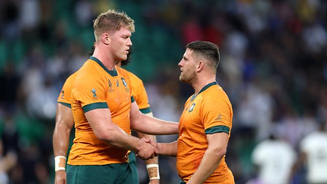 Matt Philip shakes hands with David Porecki. Photo by Catherine Ivill/Getty Images.