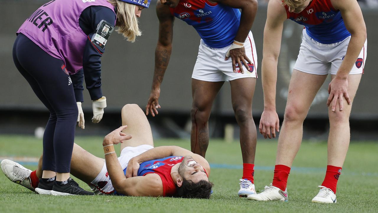 MELBOURNE, AUSTRALIAÃ&#137; June 10, 2024. AFL Round 13. Big Freeze at the G. Collingwood vs Melbourne at the MCG. Christian Petracca of the Demons in pain after copping a Darcy Moore knee in the ribs late in the 1st qtr. . Pic: Michael Klein