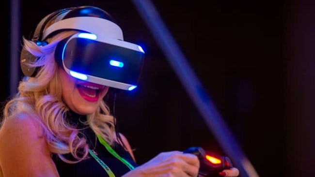 A woman plays ASTRO BOT Rescue Mission at a PlayStation VR display at the Sony Exhibit at CES in 2019. Picture: Getty/AFP