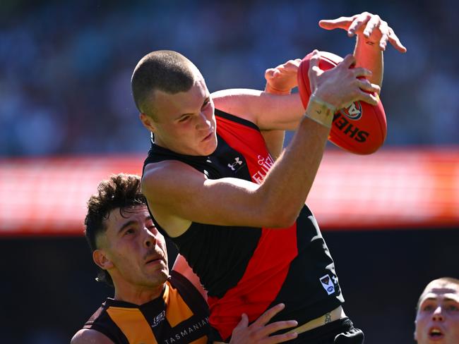 Nik Cox of the Bombers marks during the round one AFL match against Hawthorn at the MCG. Picture: Quinn Rooney/Getty Images.