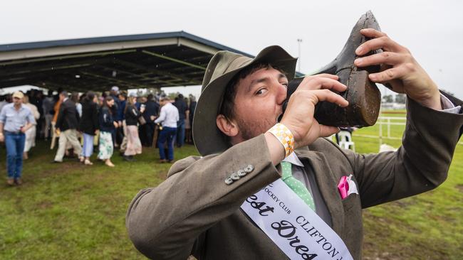 Winner of Best Dressed Male Sam Glasheen celebrated his win with a shoey at the Clifton Cup races hosted by Clifton Jockey Club, Saturday, October 22, 2022. Picture: Kevin Farmer