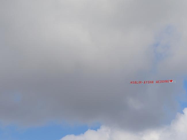 A sky sign pulled by a plane announced the wedding of Salim and Aysha. Picture: Toby Zerna