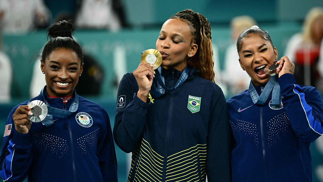 Simone Biles, Brazil's Rebeca Andrade and Jordan Chiles. Photo by Loic VENANCE / AFP