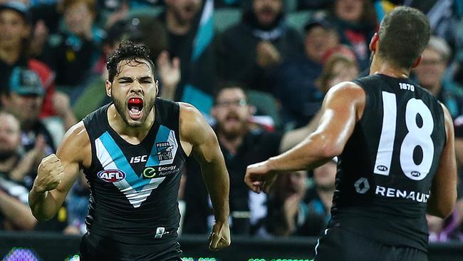 AFL — Port Adelaide v Brisbane Lions at Adelaide Oval. Jarman Impey celebrates his goal with Jimmy Toumpas. Picture Sarah Reed