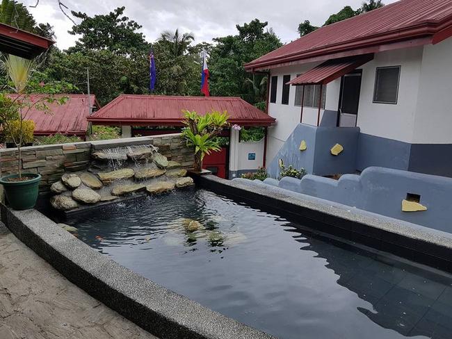 Jason Madden and his new family live in a vast home in Puerto Galera, Philippines which features a koi pond. Picture: Supplied.