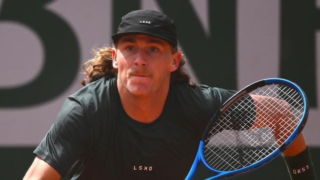 PARIS, FRANCE - MAY 27: Max Purcell of Australia runs for a shot against Henri Squire of Germany in the Men's Singles first round match on Day Two of the 2024 French Open at Roland Garros on May 27, 2024 in Paris, France. (Photo by Clive Mason/Getty Images)