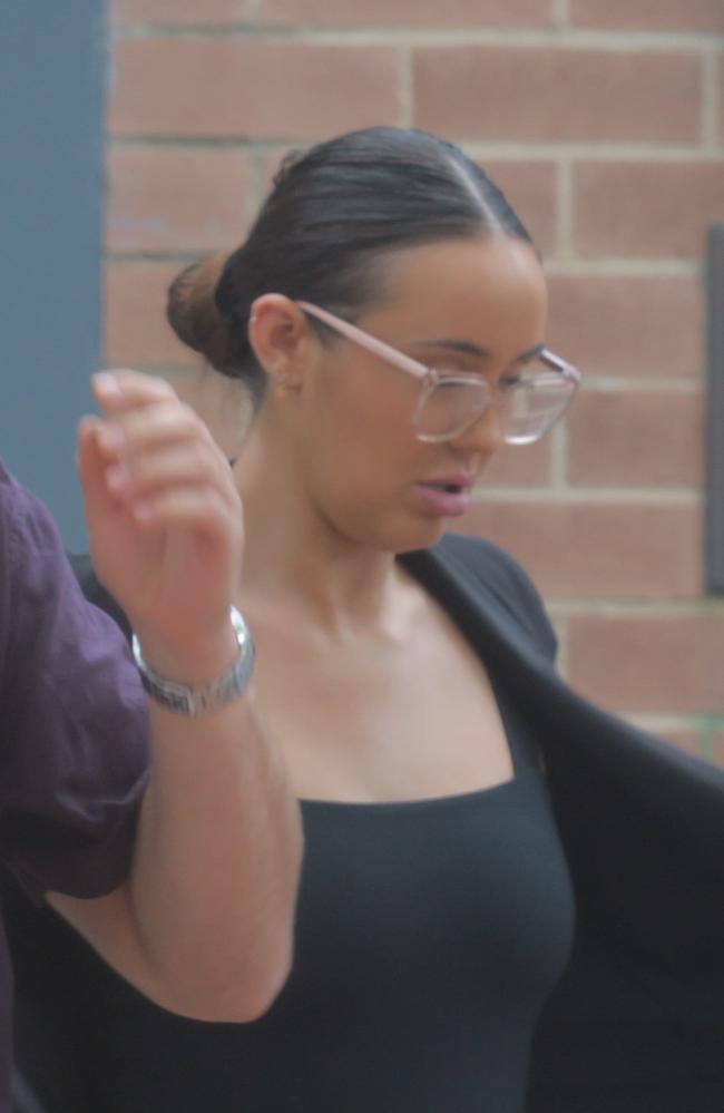 Abigail Lillian Donne, 24, (in black with glasses) leaving Wyong Local Court after pleading guilty to high range drink-driving after running into a house. Picture: NewsLocal