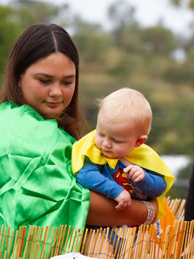 Mum and Bub wave to the crowd at the 2023 Gayndah Orange Festival.