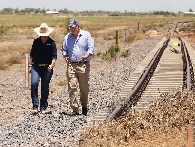 Prime Minister Scott Morrison visiting Julia Creek inspects the twisted main railway line between Mount Isa and Townsville after the devastating floods. Picture: Lyndon Mechielsen