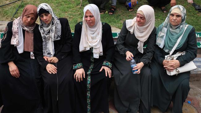 Palestinians mourn the death of their relatives following an Israeli air strike on the refugee camp of Jabalia in the Gaza Strip. Picture: Mahmud Hams/AFP