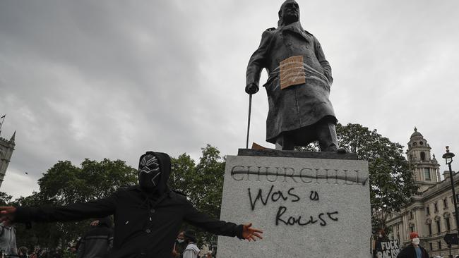 Protesters gather around Winston Churchill statue in parliament Square during the Black Lives Matter protest rally in London. Picture: AP