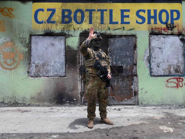 Australian soldiers conducted a brief patrol of a burnt out area in China Town, Honiara, Solomon Islands. Picture: Gary Ramage