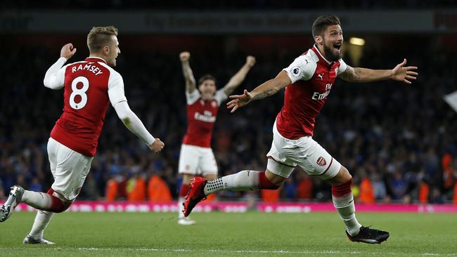 Arsenal's French striker Olivier Giroud (C) celebrates scoring Arsenal's fourth goal./