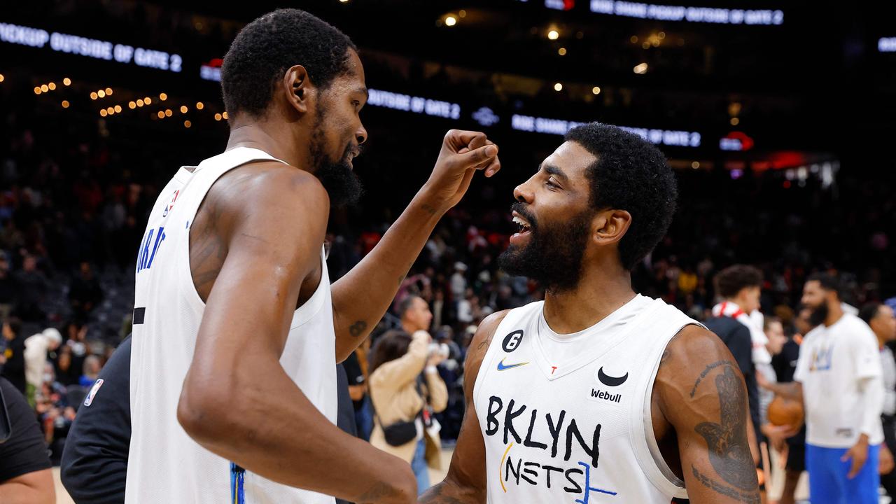 ATLANTA, GA – DECEMBER 28: Kevin Durant #7 of the Brooklyn Nets reacts withy Kyrie Irving #11 after their 108-107 victory over the Atlanta Hawks at State Farm Arena on December 28, 2022 in Atlanta, Georgia. NOTE TO USER: User expressly acknowledges and agrees that, by downloading and or using this photograph, User is consenting to the terms and conditions of the Getty Images License Agreement. Todd Kirkland/Getty Images/AFP (Photo by Todd Kirkland / GETTY IMAGES NORTH AMERICA / Getty Images via AFP)