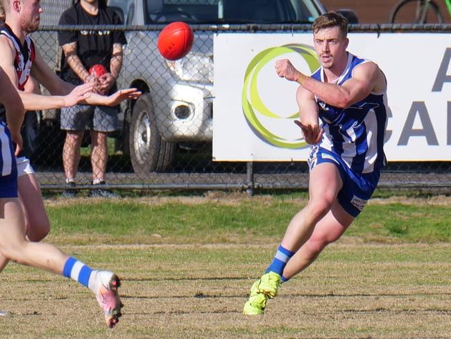 Zach Andrewartha fires out a handball for Langwarrin. Picture: Paul Stanley Churcher