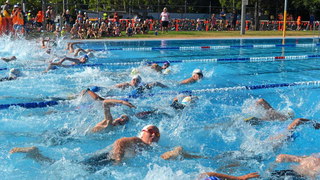 SWIM RELIEF: Swimmers took to the pool for the first part of the triathlon. Picture: Meg Gannon