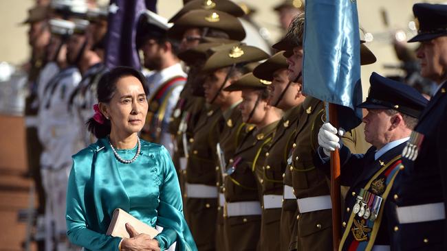 Aung San Suu Kyi receives an official welcome on the forecourt during her visit to Parliament House in Canberra yesterday. Photo: AFP