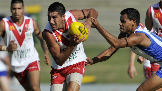 Marlion Pickett bursts through a tackle in the WAFL for South Fremantle.