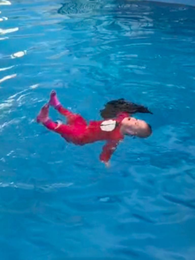 The baby swiftly threw the cloth off her face and continued to float. Picture: TikTok